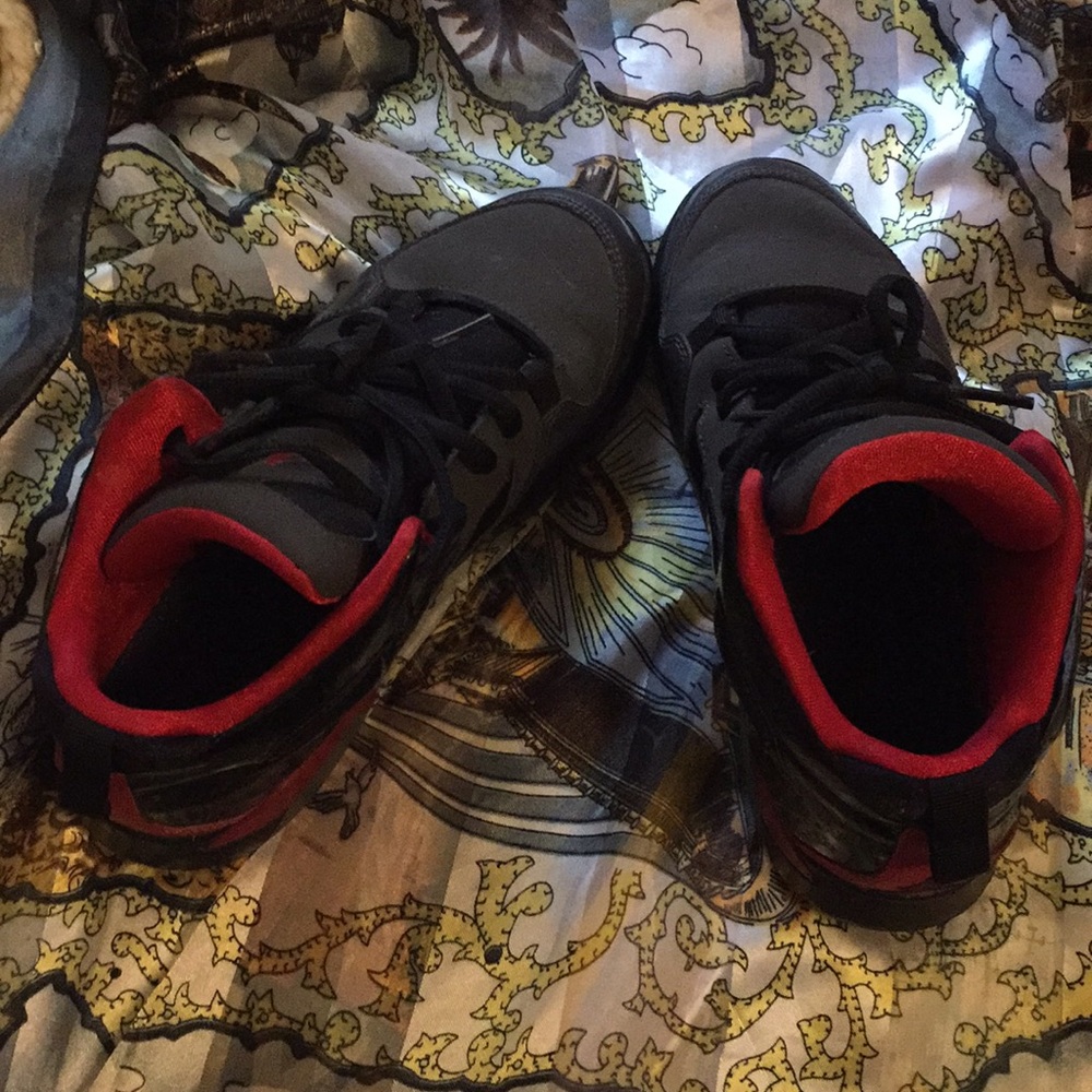 Red and grey and black Jordan’s